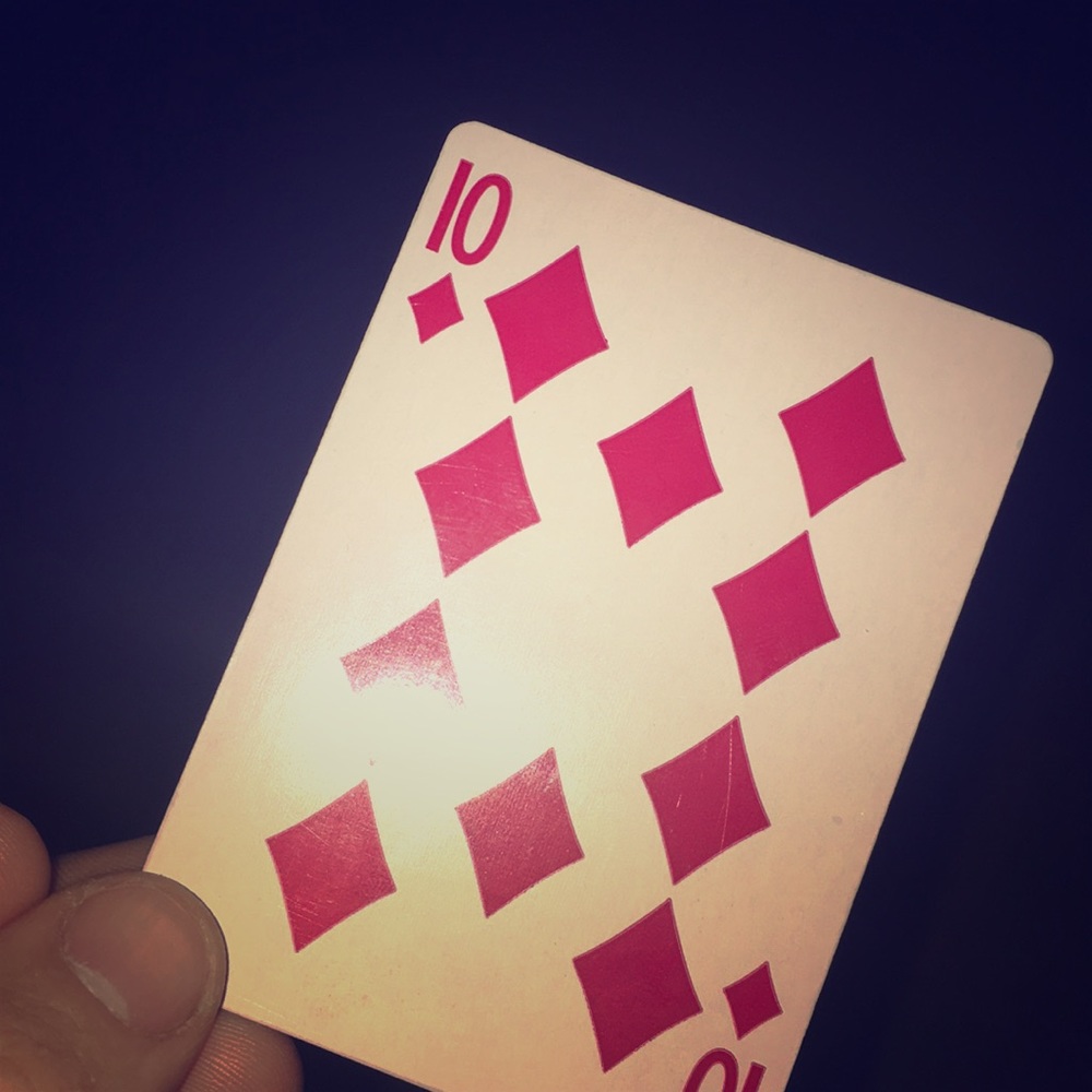 A single 10 of diamonds card